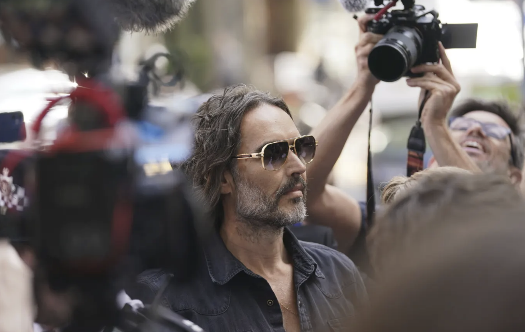 Russell Brand granted conditional bail after appearing in London court on rape and assault charges